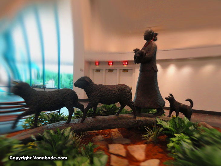 life size Indian sculpture with lamb, dog and sheep