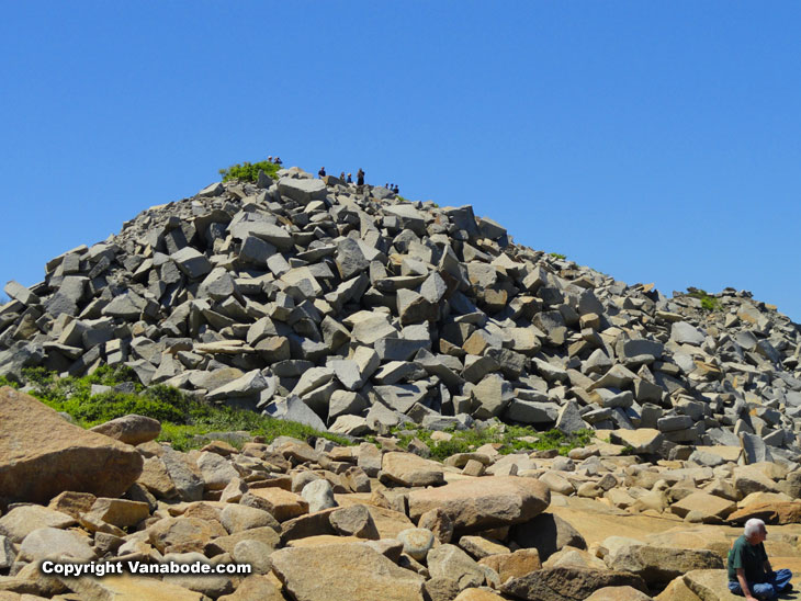 rock quarry cliffs lead to the ocean and beach