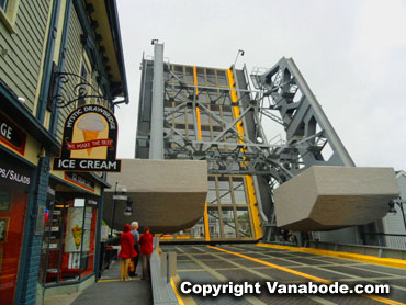Mystic Connecticut drawbridge with balancing weights opens over the river