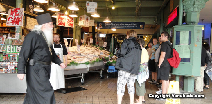 picture of passer bys in seattles seafood market