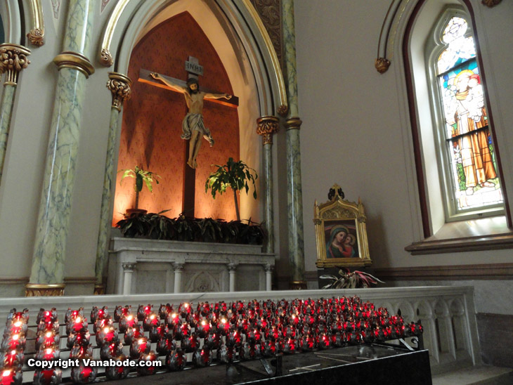 Incredible crucifix sculpture above buring candles picture